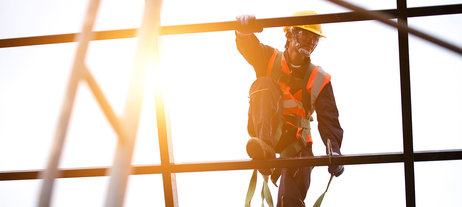 Roof repairman, construction engineer wearing safety inspection kit in Asia